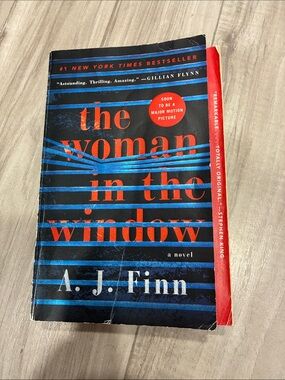 The Woman in the Window by A. J. Finn — Black & Red Paperback
